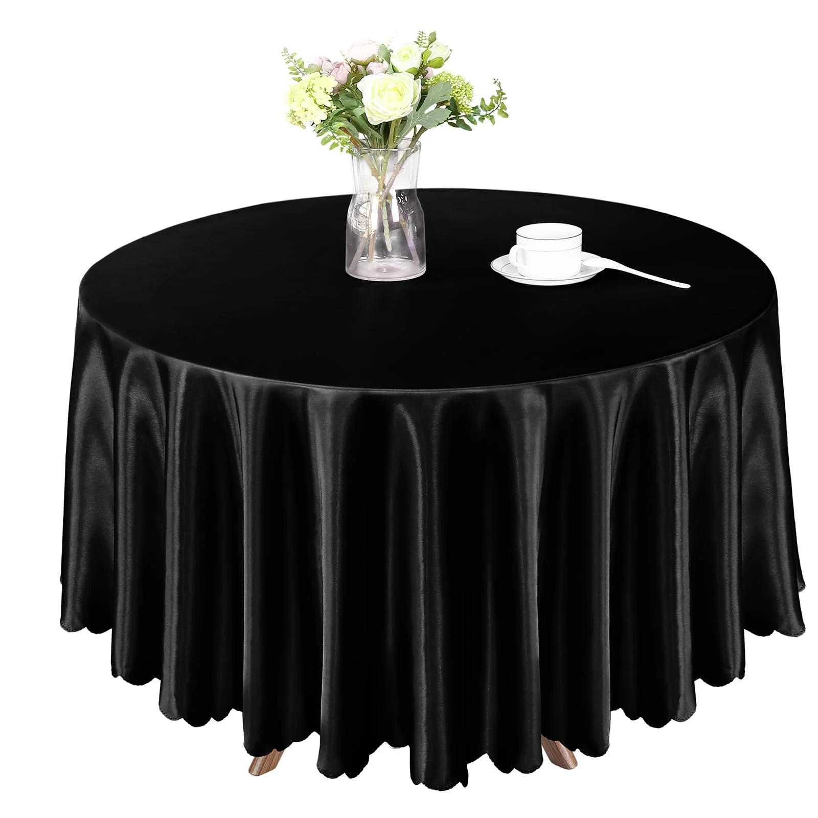 The 84 inch satin round in black, dressed for dinner