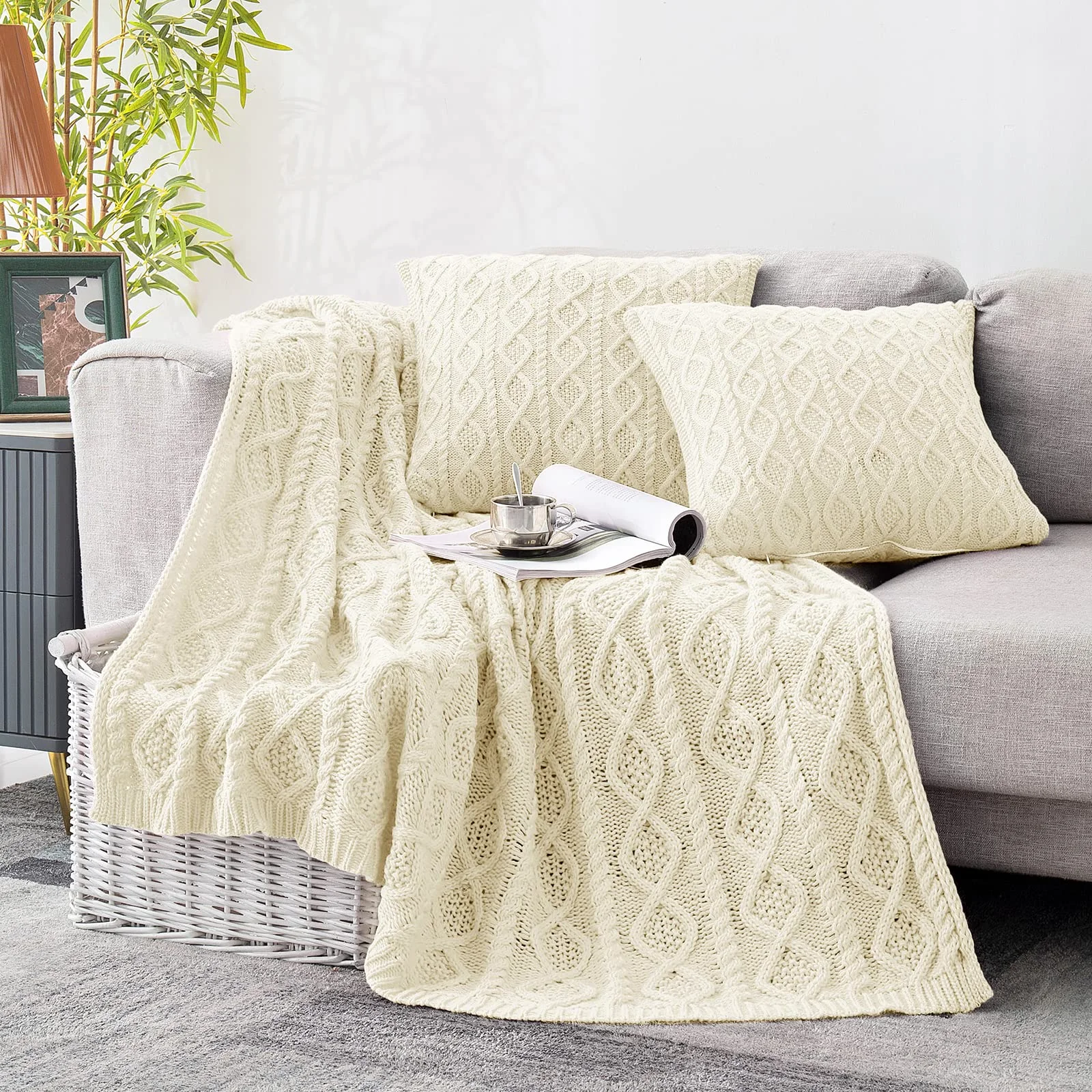 The cable knit throw and pillow covers in cream white